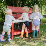 Kniti Überhose mit 3 Kindern Rückansicht